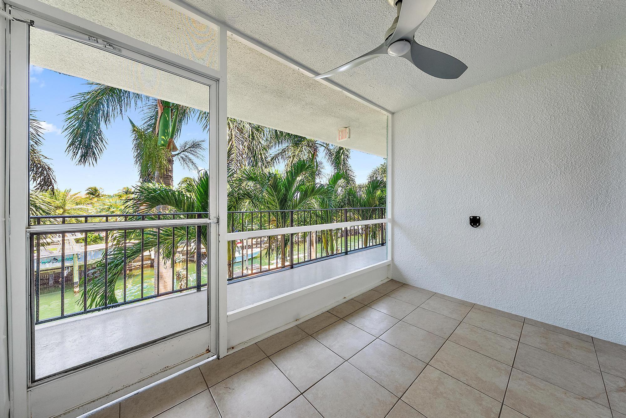 Image 4: Screened in patio with waterway views.