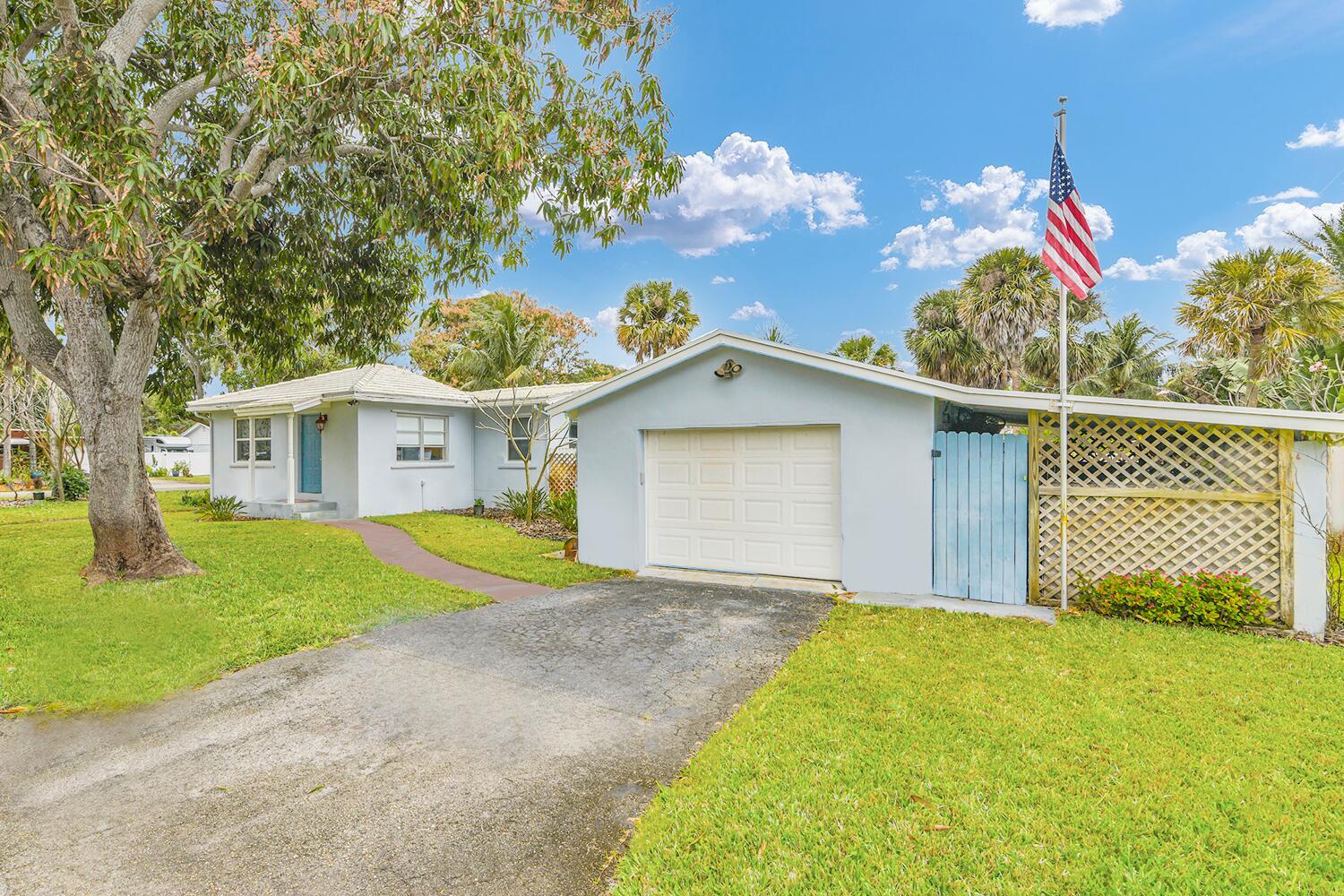 Image 1: Current Home with Garage