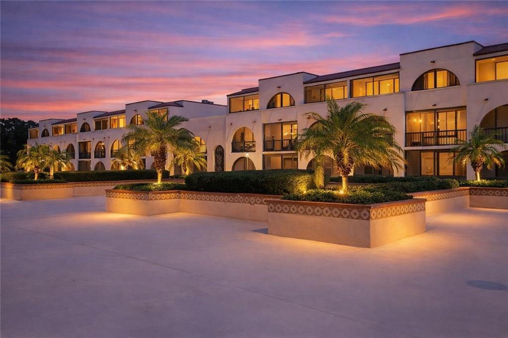 Image 2: The property features a multi-story building with