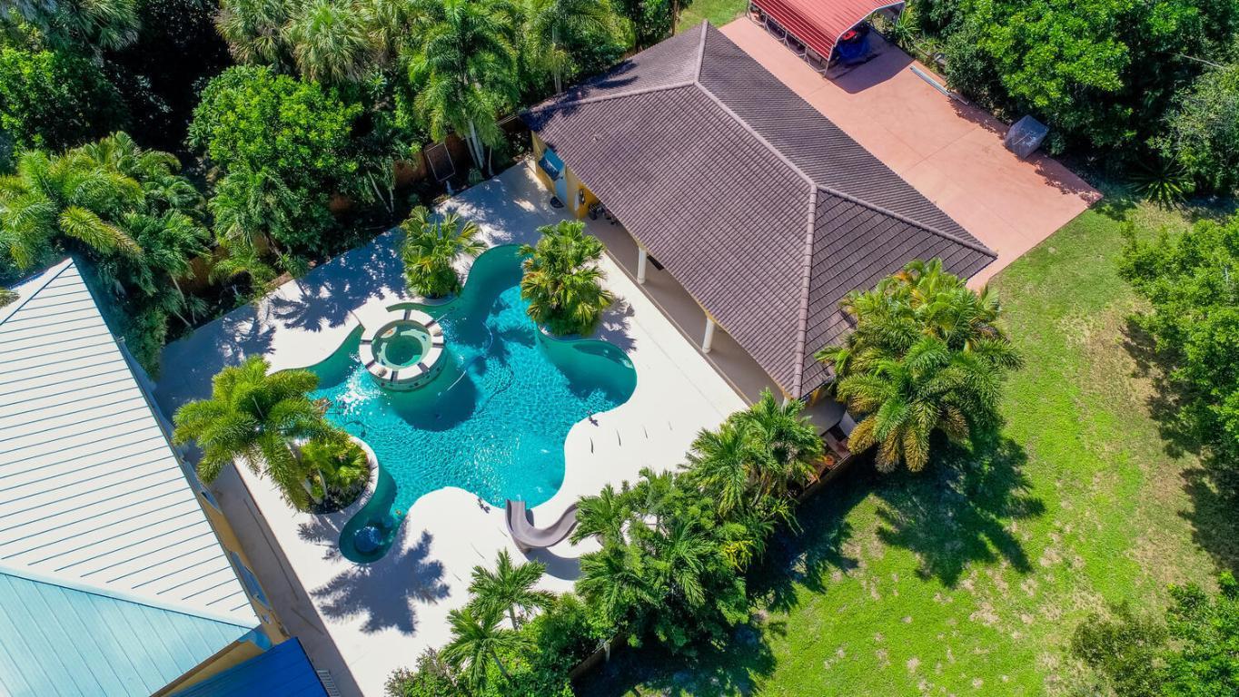 Image 3: 3 Car Garage with Gym & Bath Behind Home