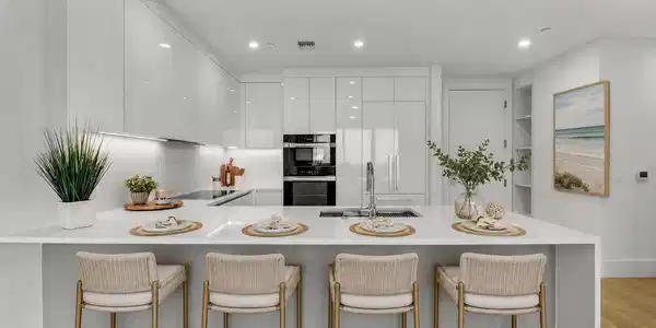 Image 3: Kitchen bar with stools - Staged