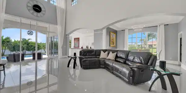 Image 3: Expansive living area featuring high ceilings and