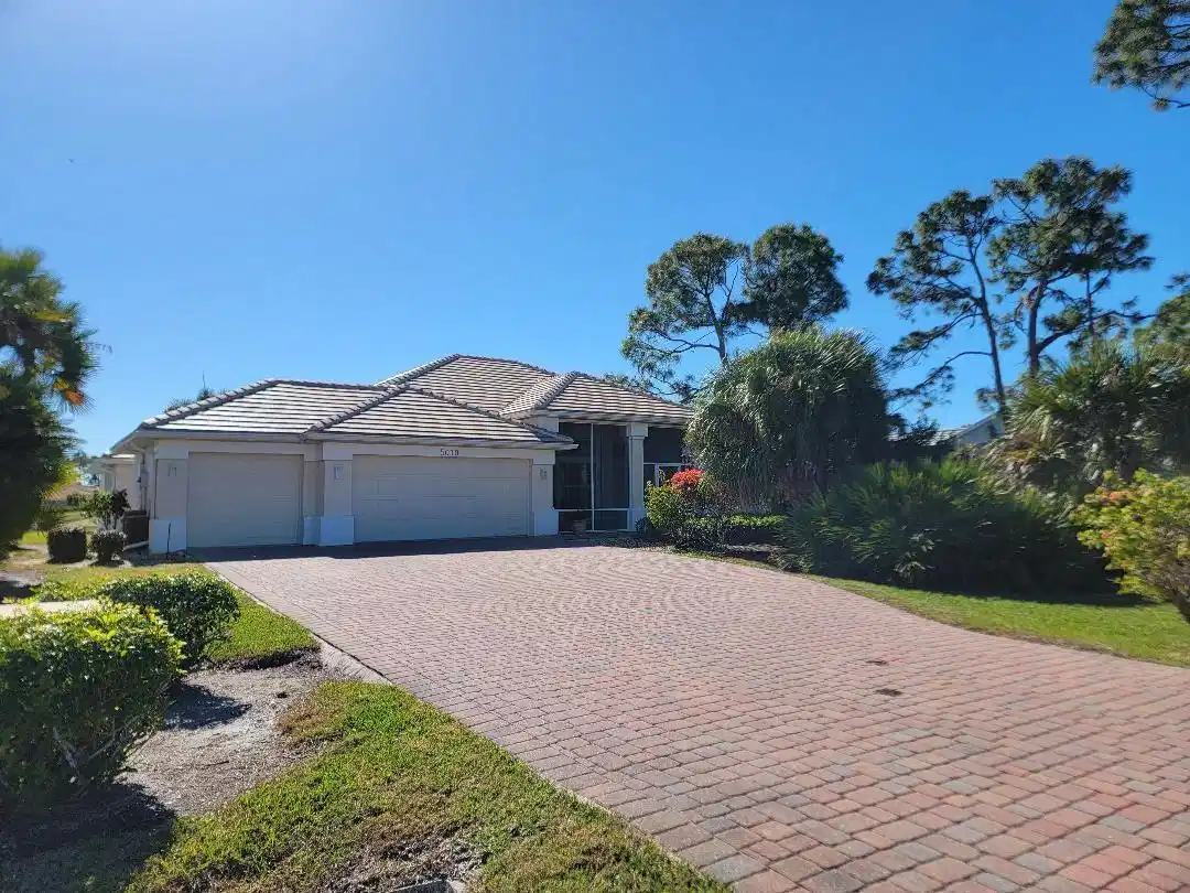 Image 1: Single story home with a 3 car garage, long pavere