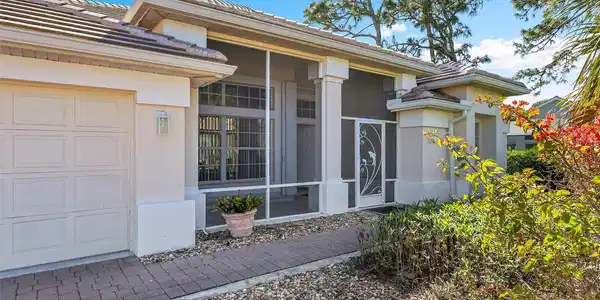Image 4: Property entrance featuring a screened front porch