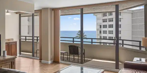 Image 3: Expansive oceanfront living room showcasing floor-