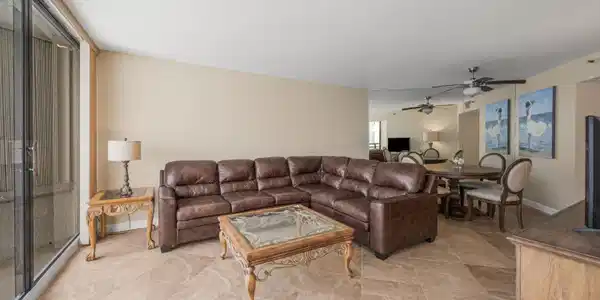 Image 4: Spacious living area featuring large format tile f