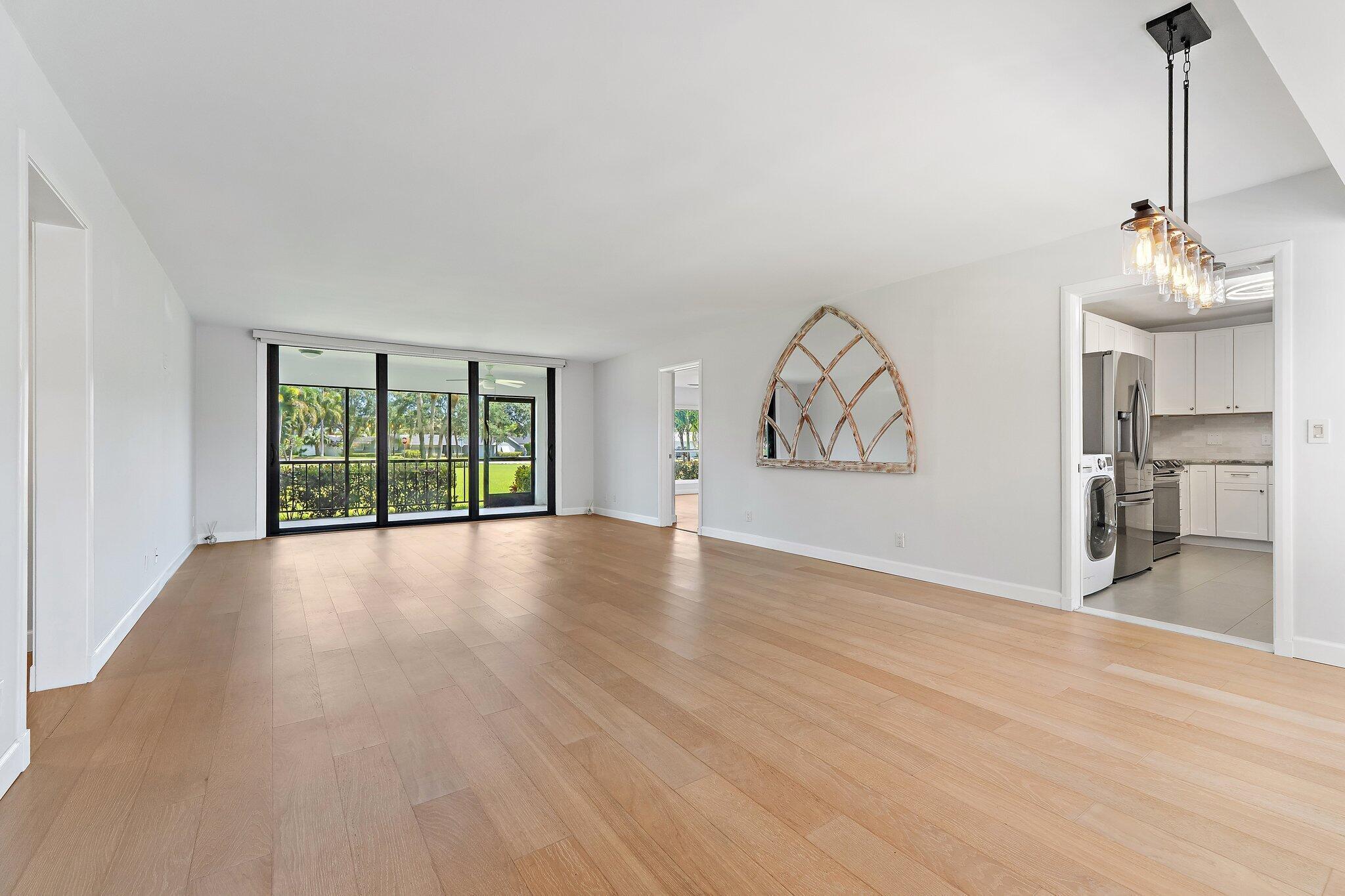 Image 2: Bright, open living space with new wide-plank floo