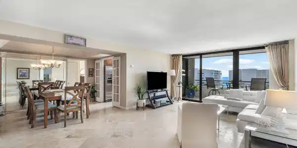 Image 4: Expansive living area with large format tile floor