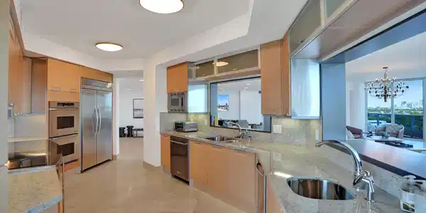 Image 4: Chef's kitchen with stainless steel appliances, sl