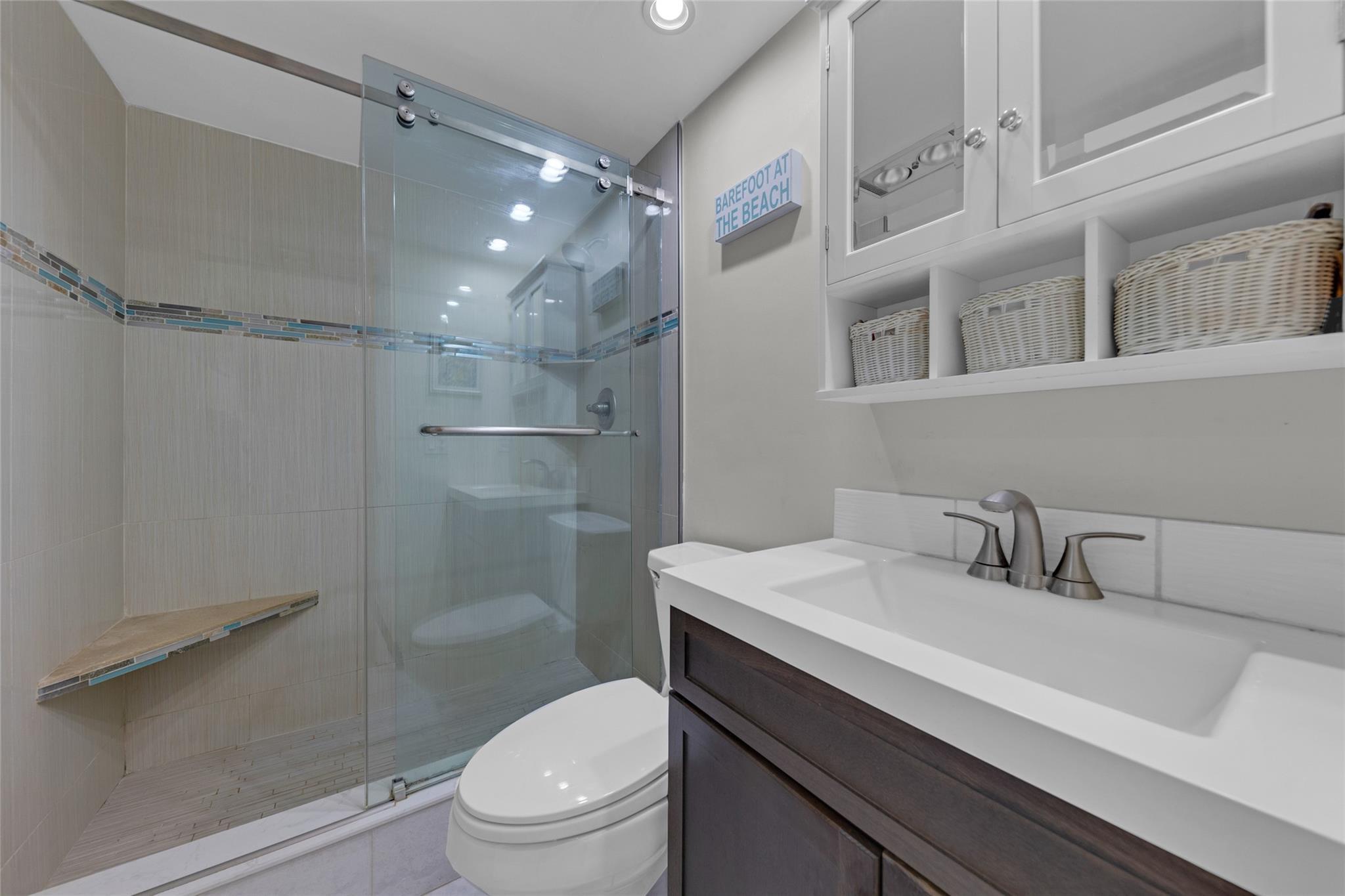 Image 3: Master bathroom has been updated and offers a walk