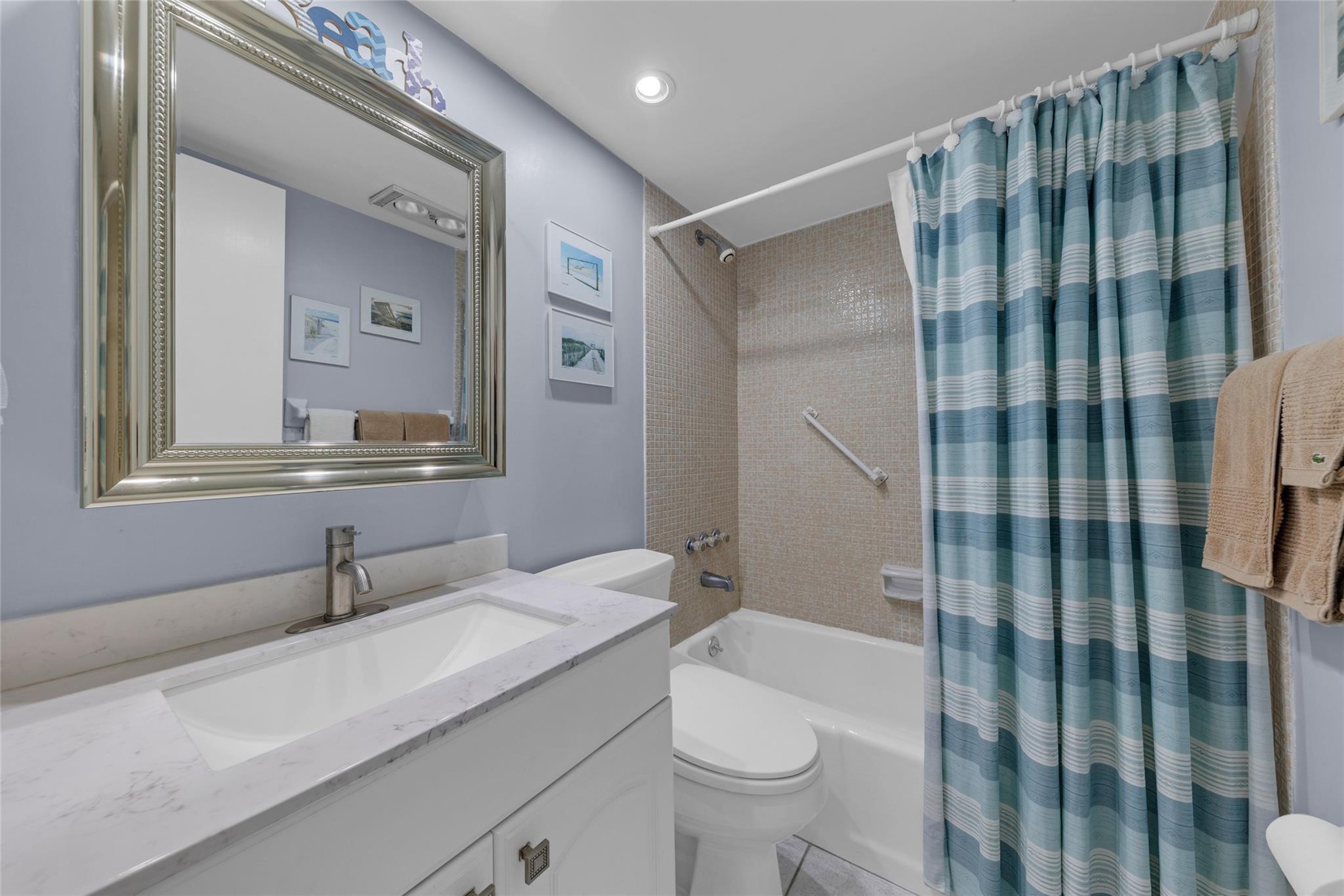 Image 4: Second full bathroom is updated with a tub/shower