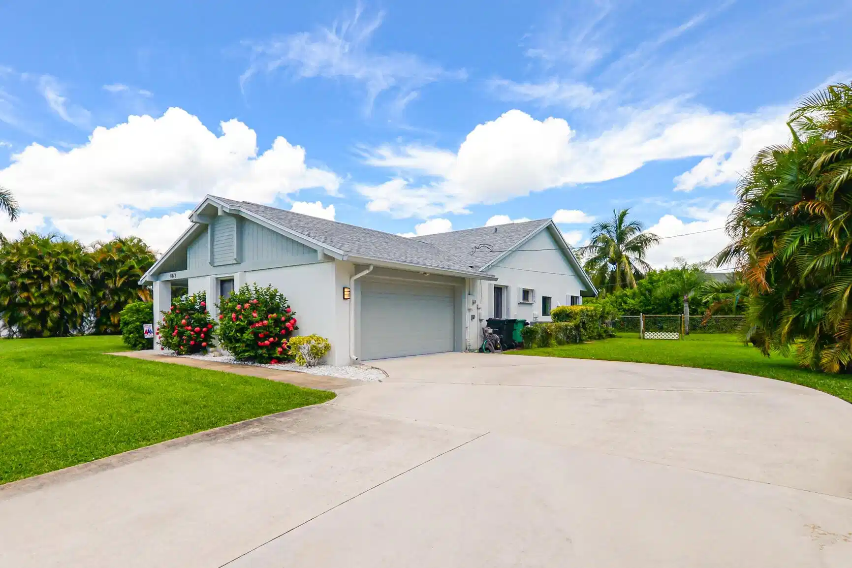 Image 1: Single-story residence featuring a light gray roof
