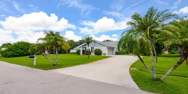 Image 4: Single-story residential property featuring a gray