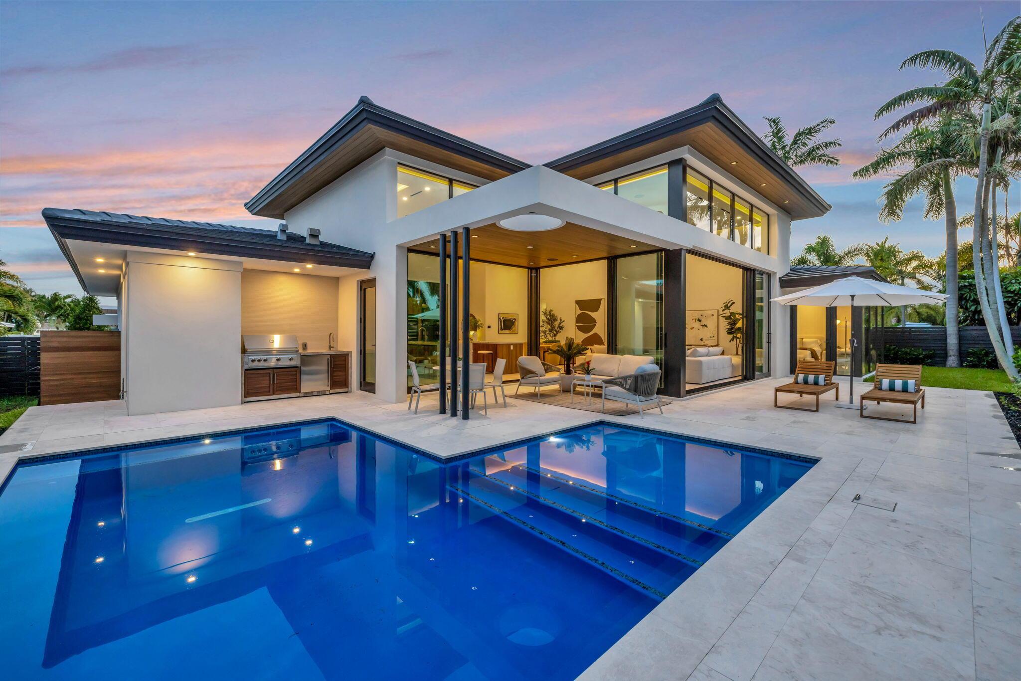 Image 3: A resort-style patio setting connects the interior