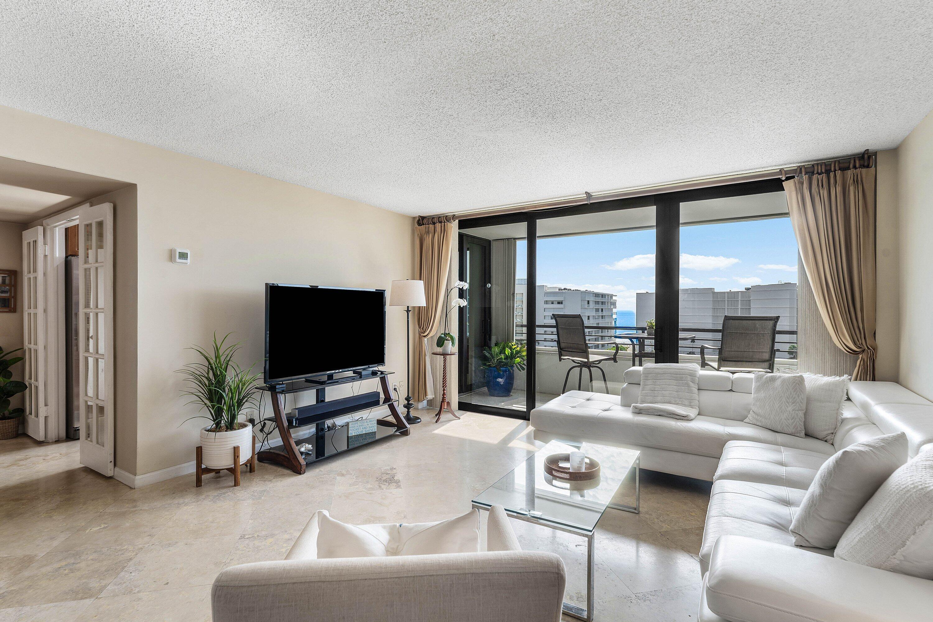 Image 3: Living area with large format tile flooring and ex