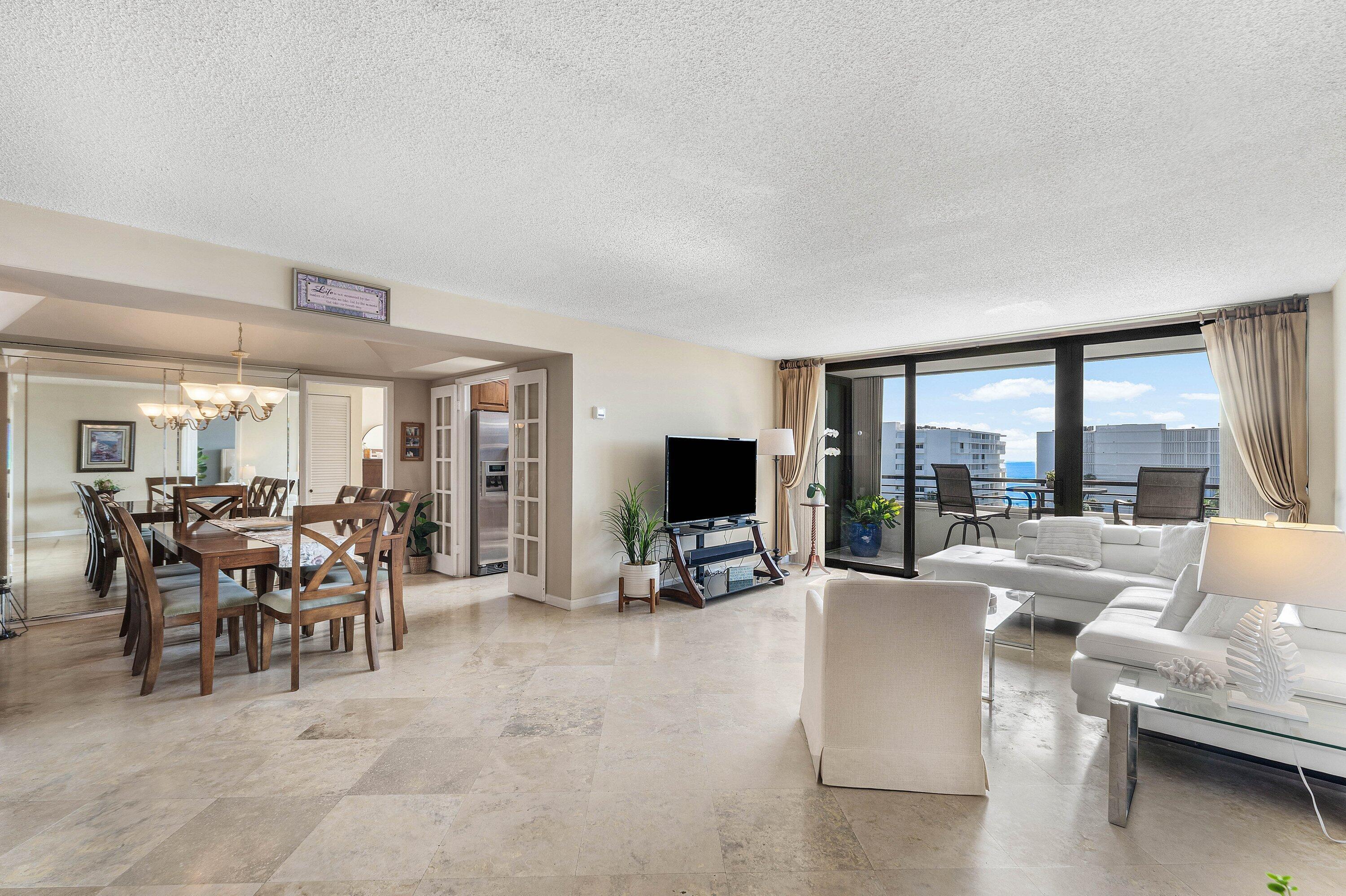 Image 4: Expansive living area with large format tile floor