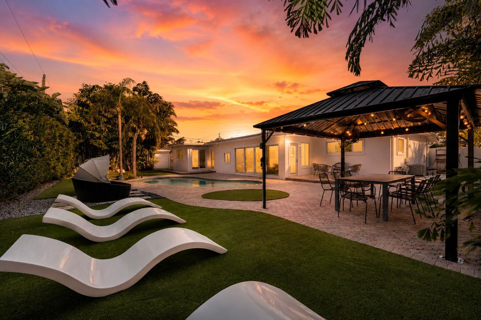 Image 2: Luxurious outdoor entertaining space featuring a m