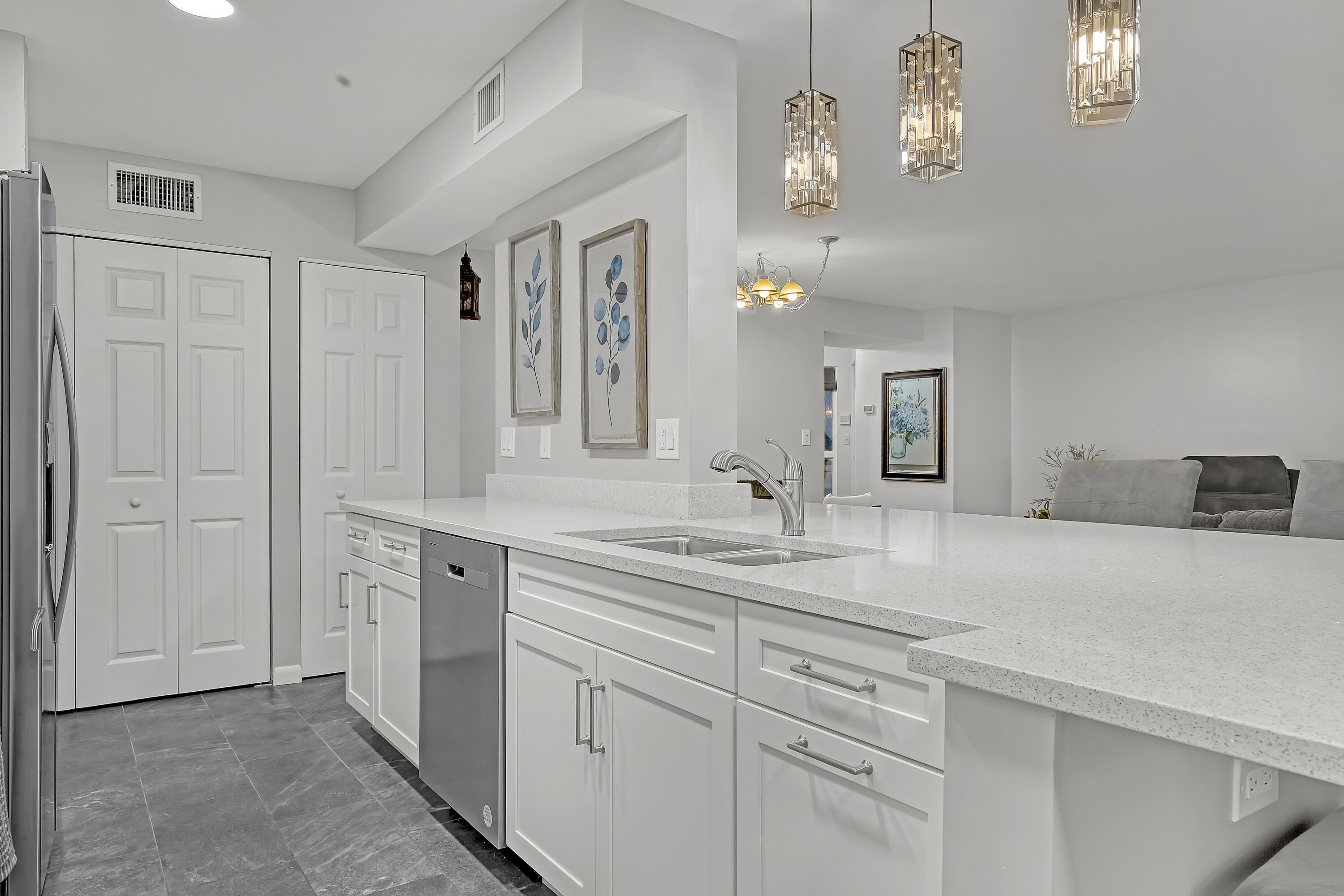 Image 3: Updated surfaces and appliances make meal prep eff