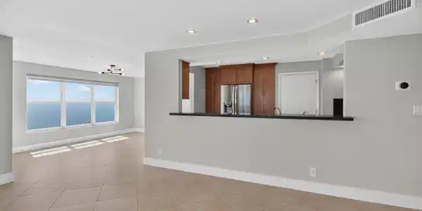 Image 3: The open kitchen connects effortlessly with the di