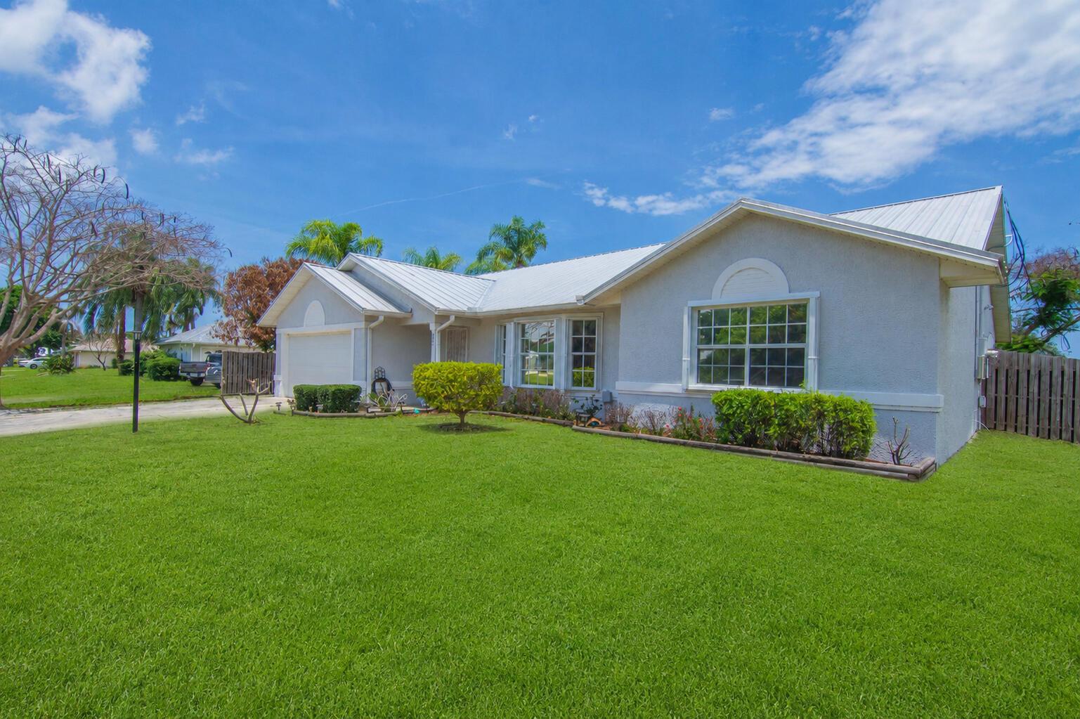 Image 1: Front of House, new lawn. AI generated