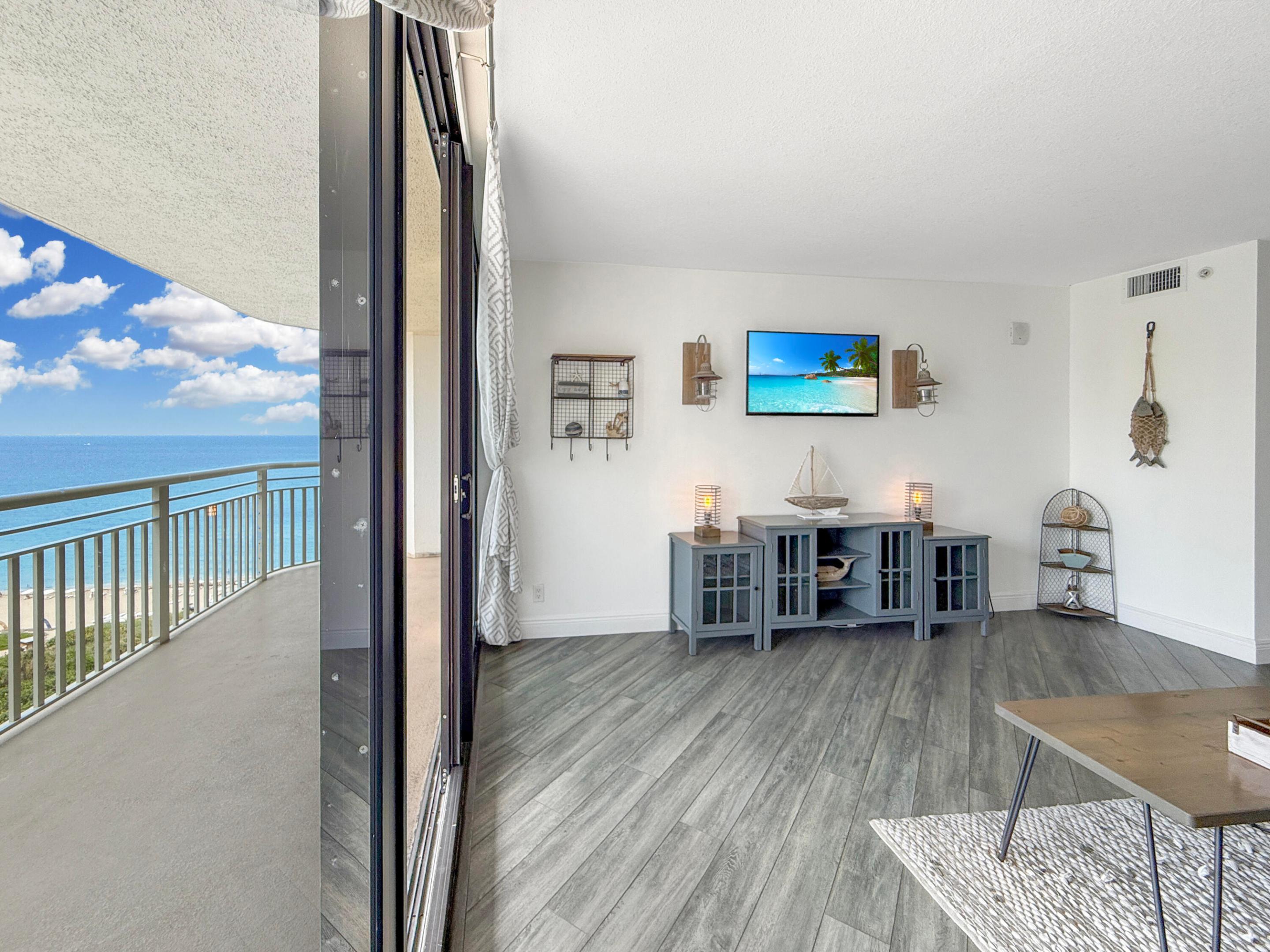 Image 4: Living Room w/ Balcony Access