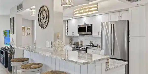 Image 3: Custom breakfast bar opens to dining/living area.
