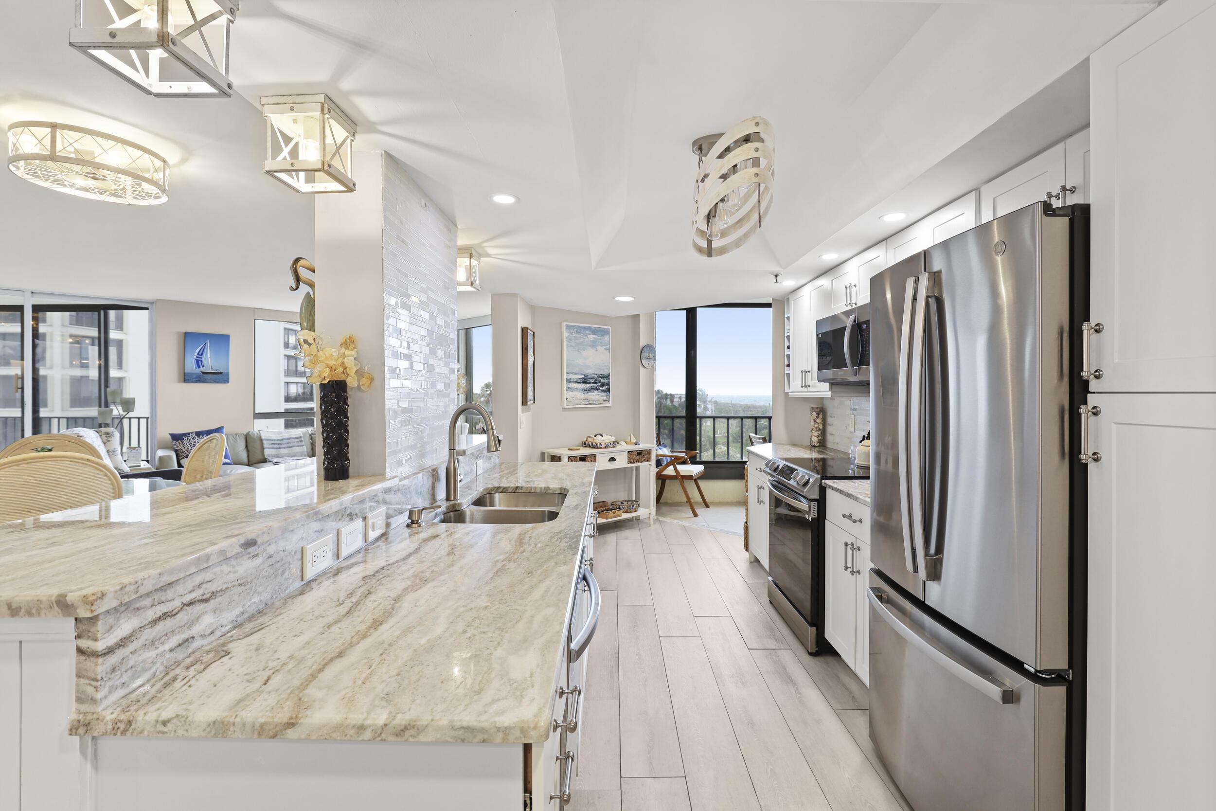 Image 4: Completely renovated kitchen featuring high-end gr