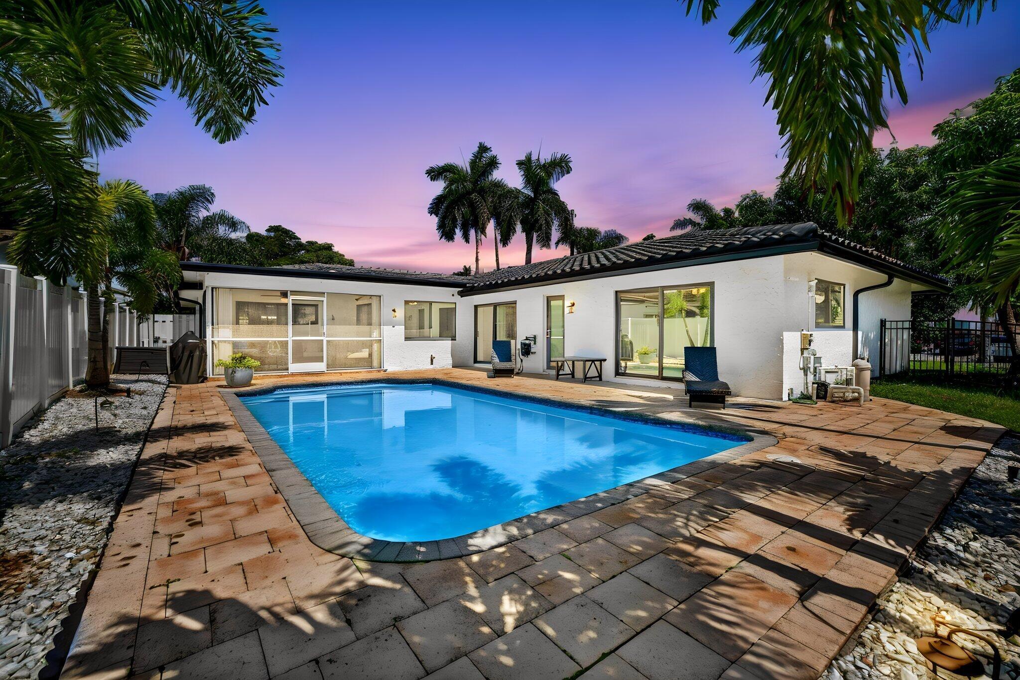 Image 1: 02_Twilight_Pool_Rear_Exterior
