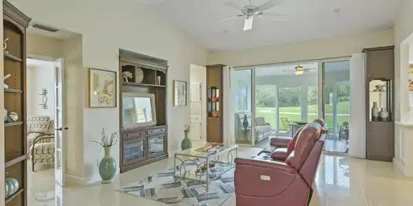 Image 3: Spacious living area featuring polished tile floor