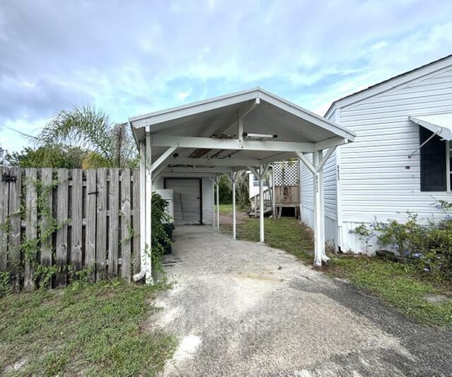 Image 2: Included Carport & Large Shed