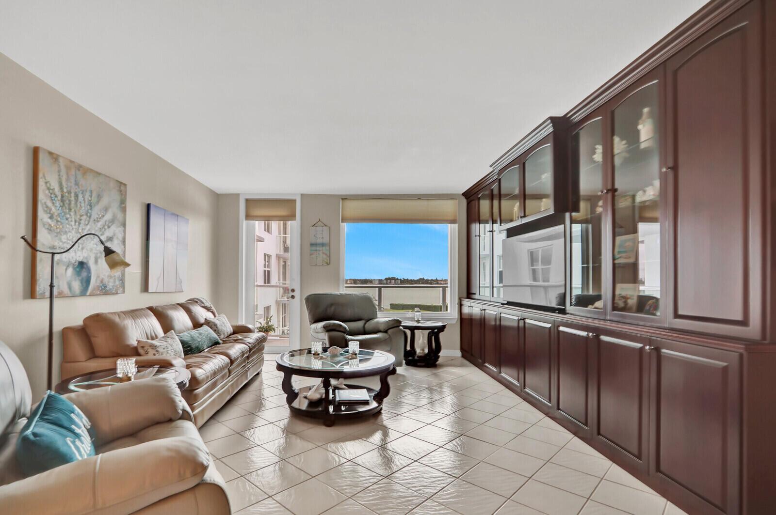 Image 3: Spacious Living Room with Water Views