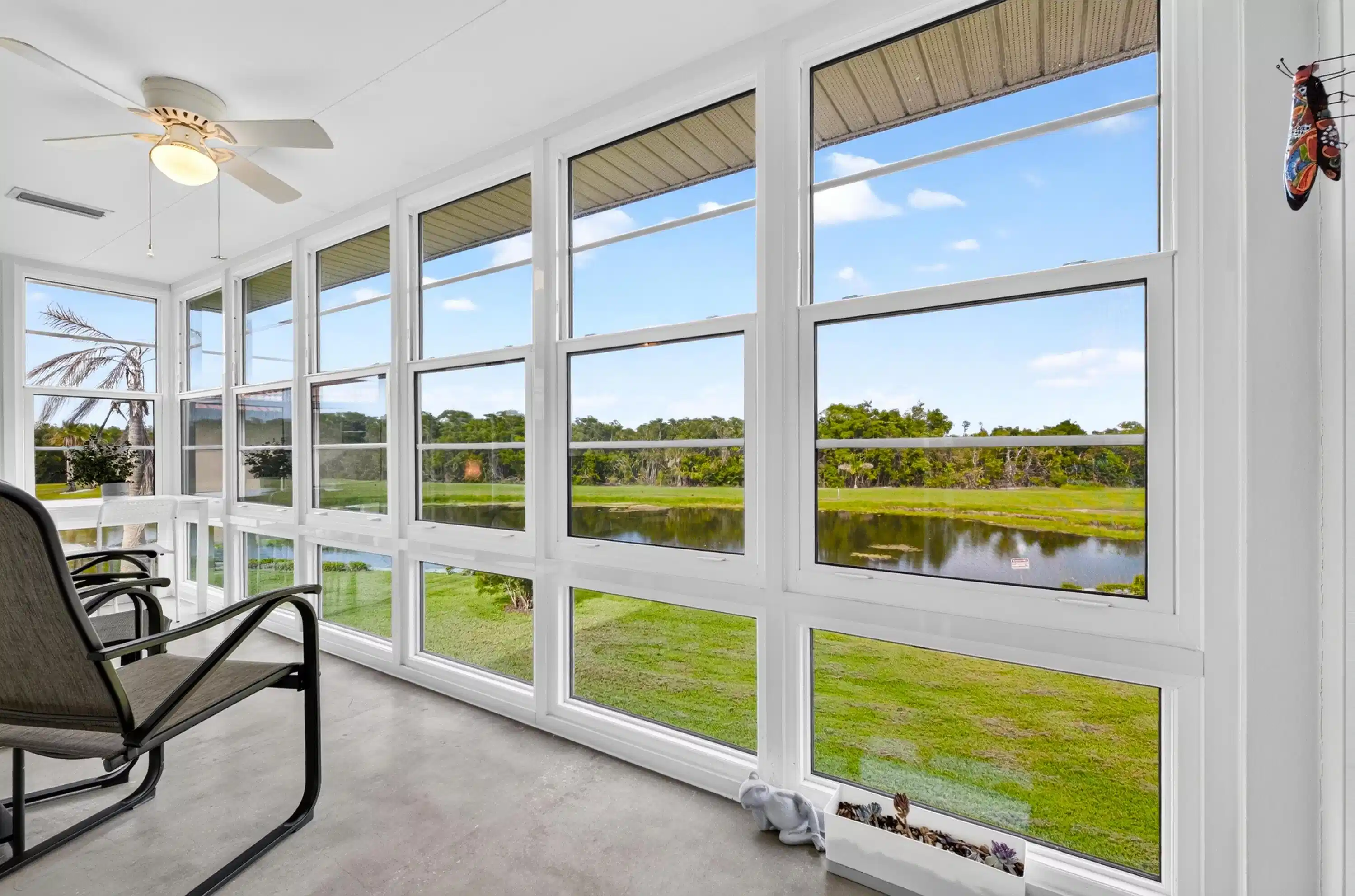 Image 1: Not your normal lanai, features impact windows and