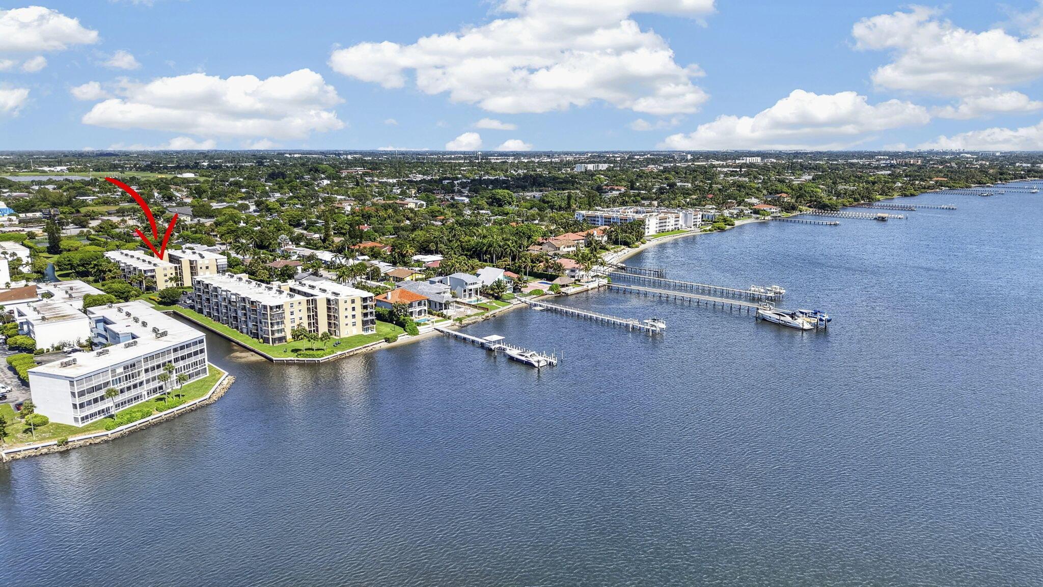 Image 1: Waterfront condominium community featuring multipl