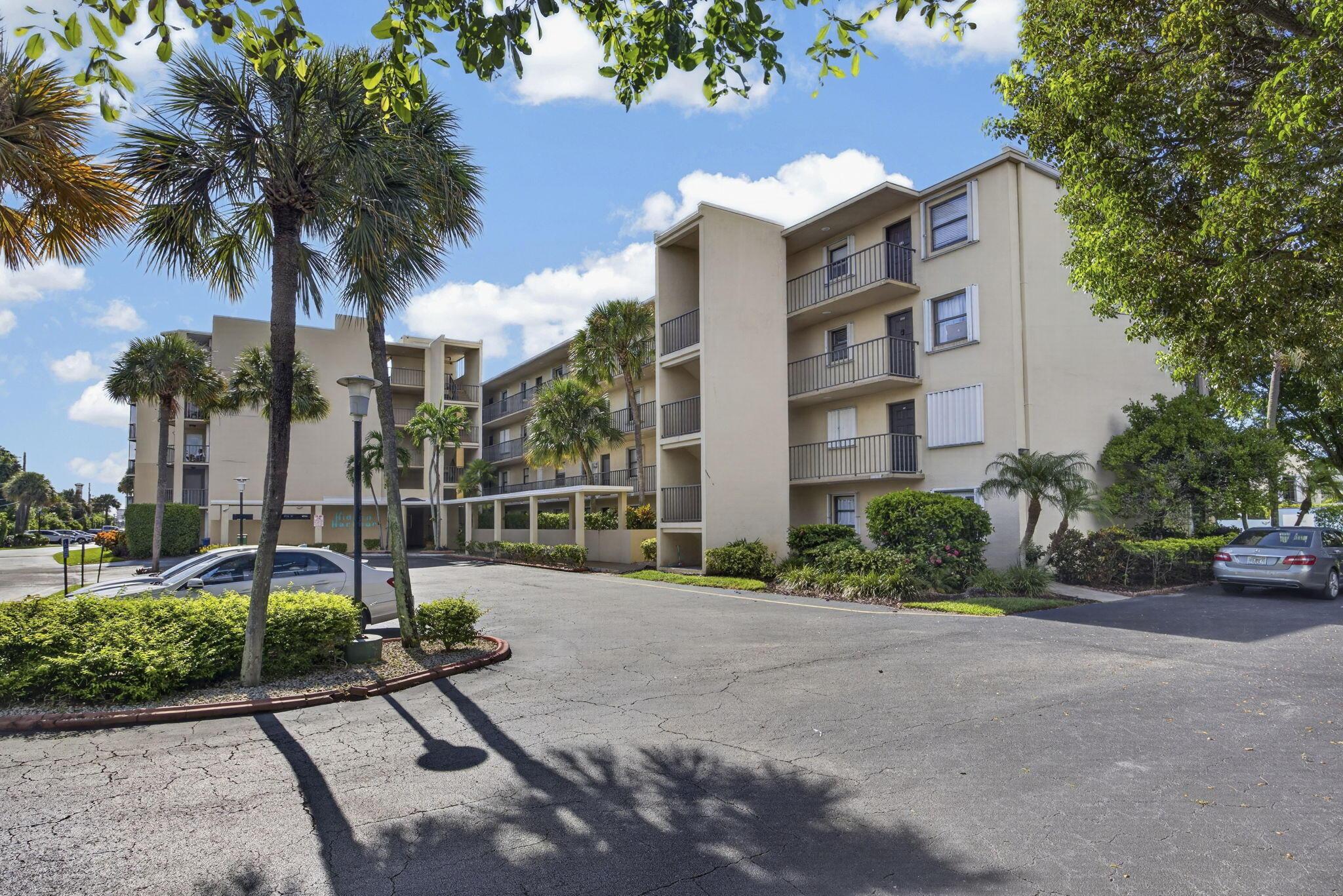 Image 3: Multi-story stucco exterior with individual balcon
