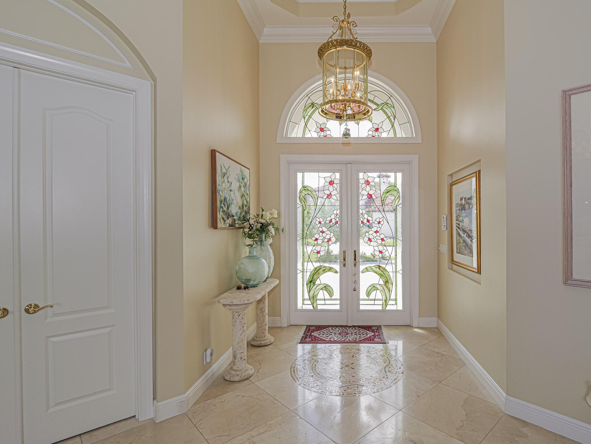 Image 3: Foyer with Mc Mow Art Glass Front Door