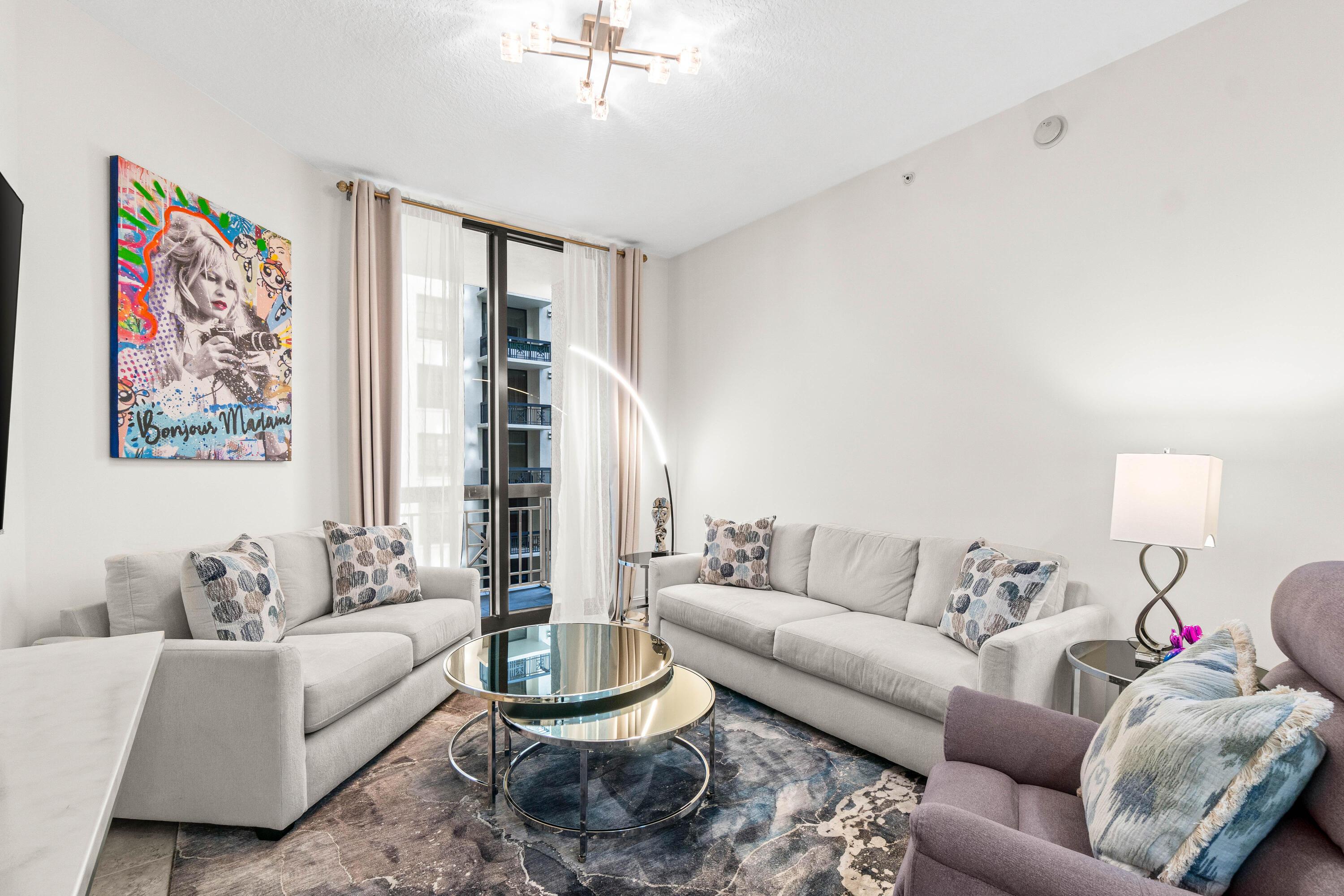 Image 4: Living Room w/ Balcony Access