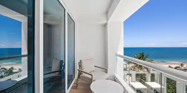 Image 3: Balcony with wood-finish flooring and glass railin