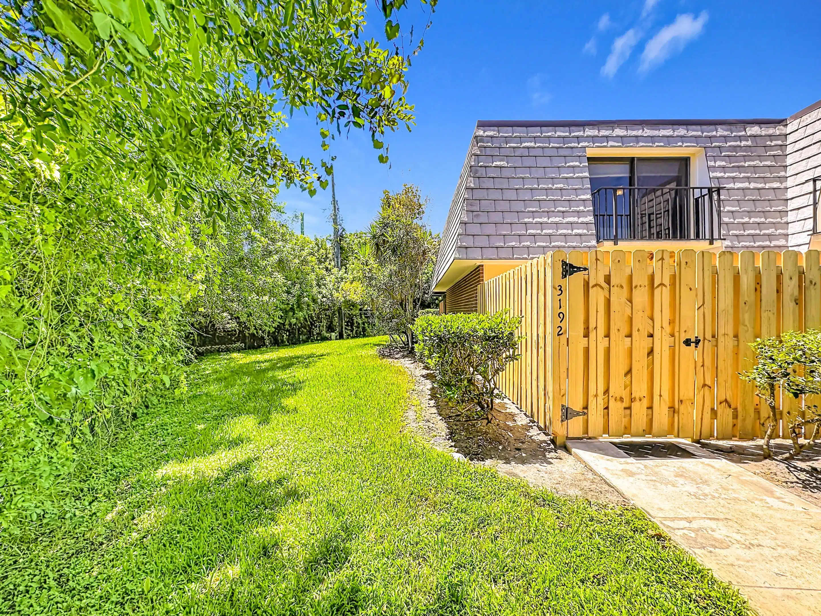 Image 1: Newly fenced patio and backyard greenspace preserv