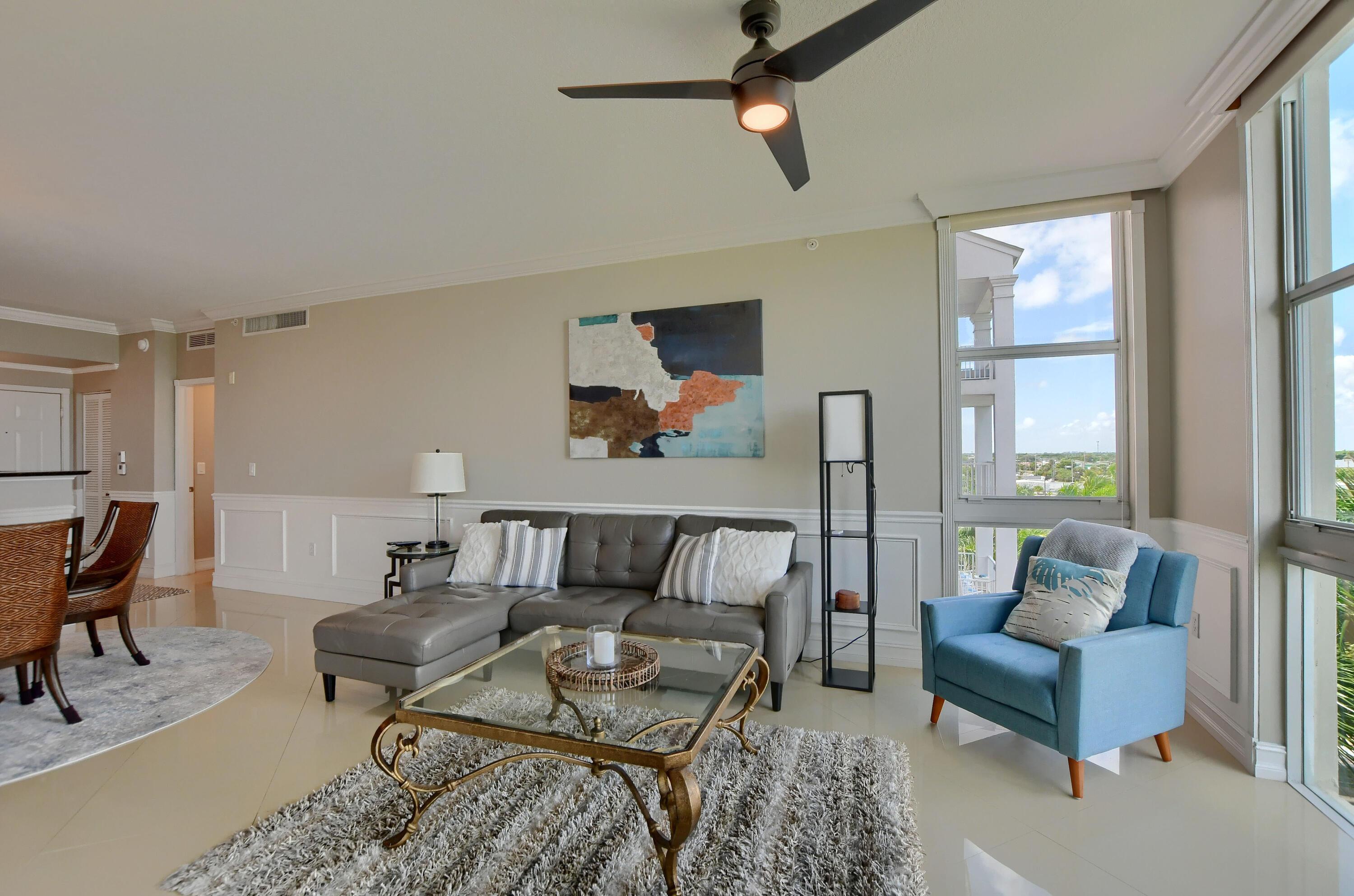 Image 3: Floor-to-ceiling windows, light-toned tile floorin