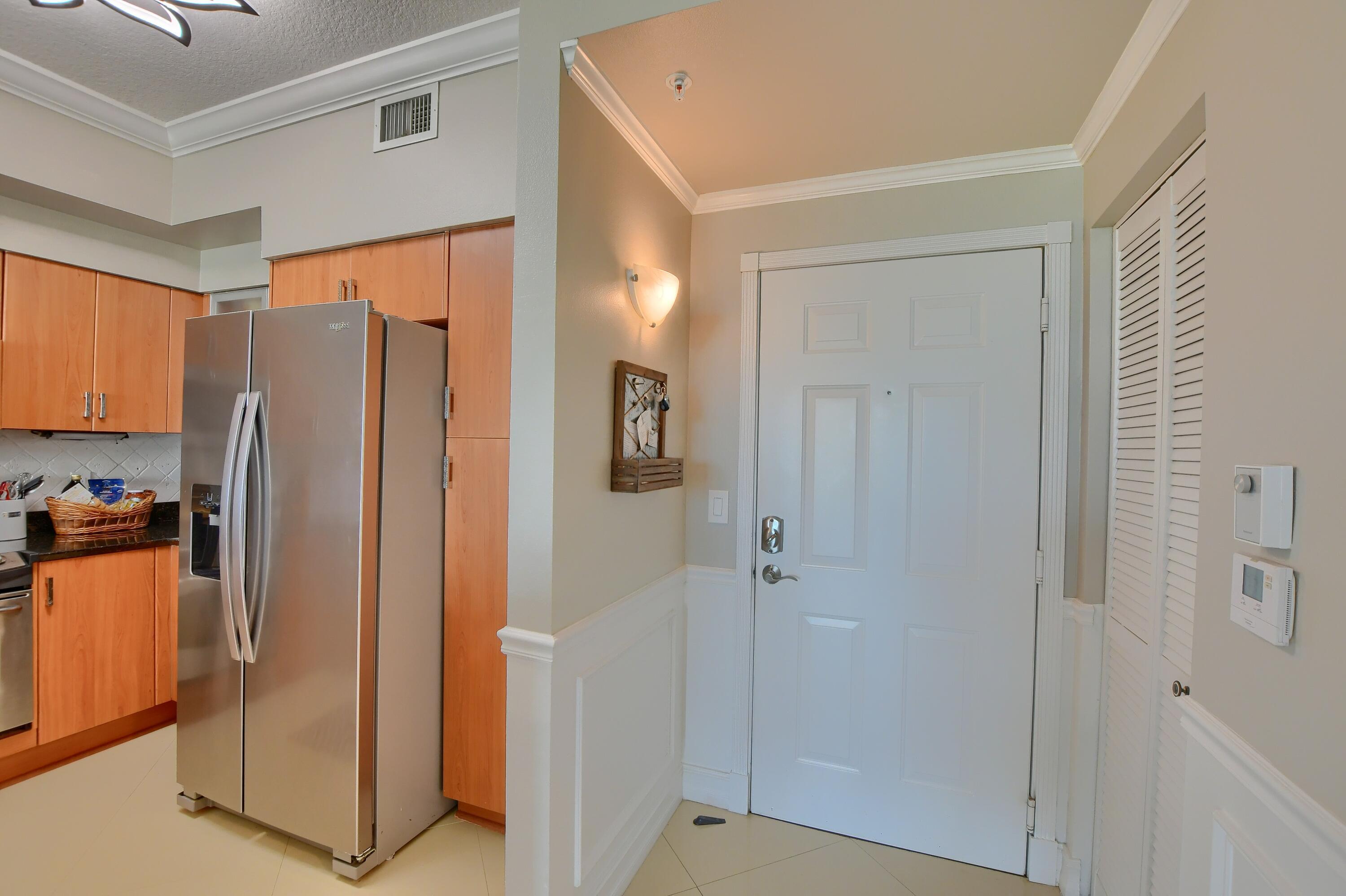 Image 4: Entryway with wainscoting and crown molding