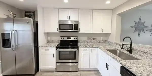Image 3: White cabinets, granite counters, SS appliances, &