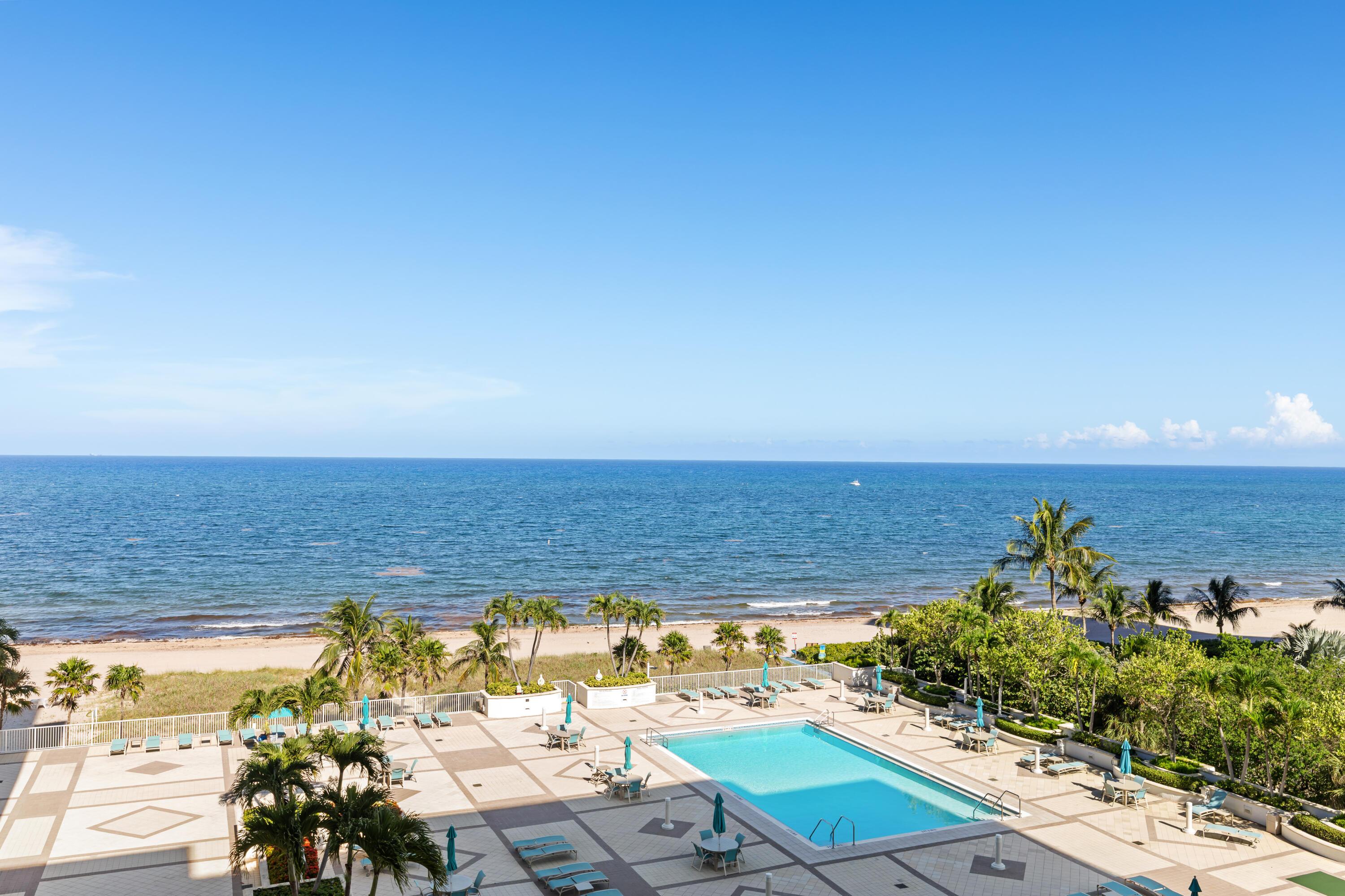 Image 3: EXPANSIVE POOL DECK WITH LOUNGES, BBQ, AND HEATED