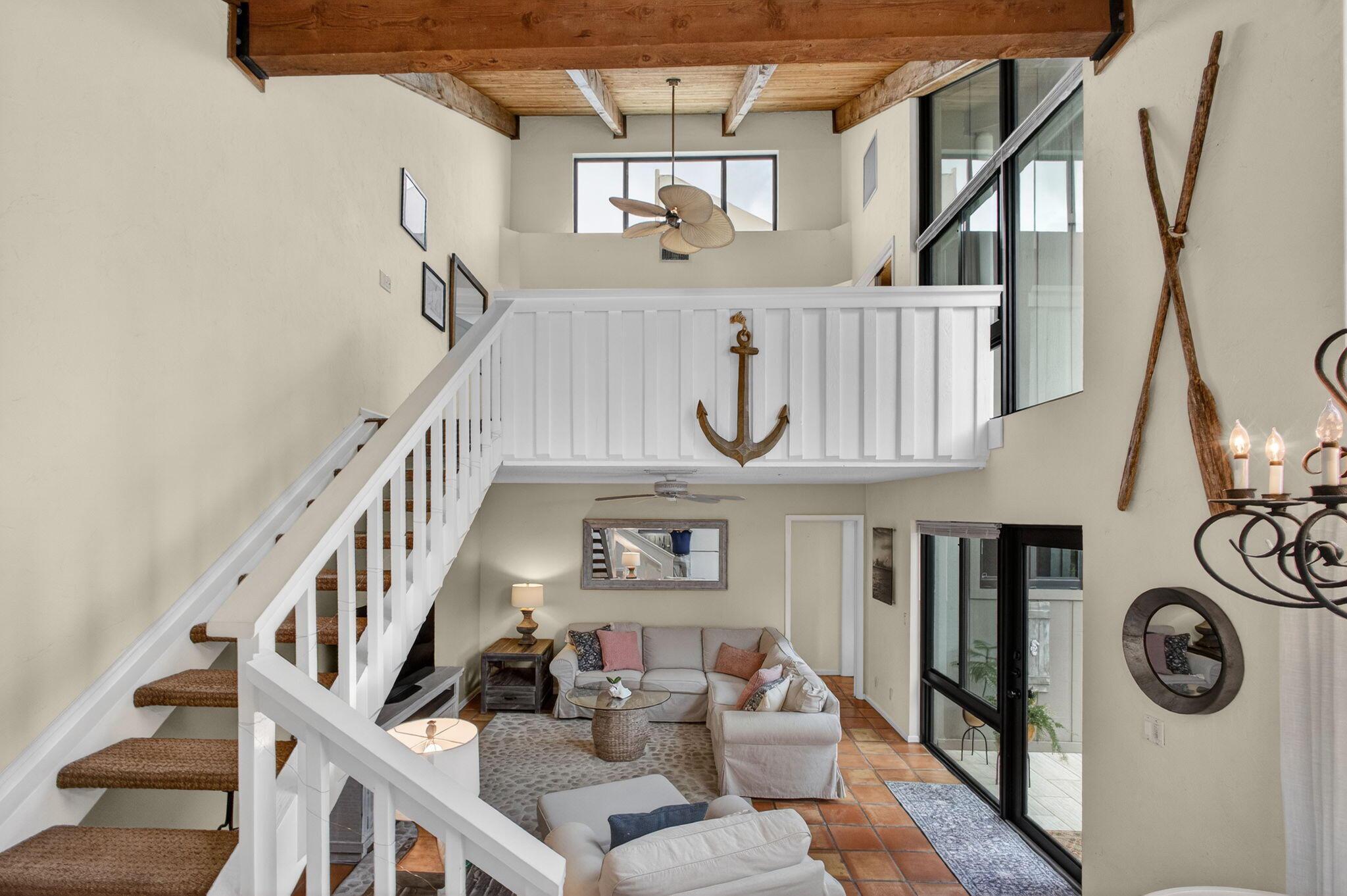 Image 2: Elevated sun drenched loft overlooks the main livi