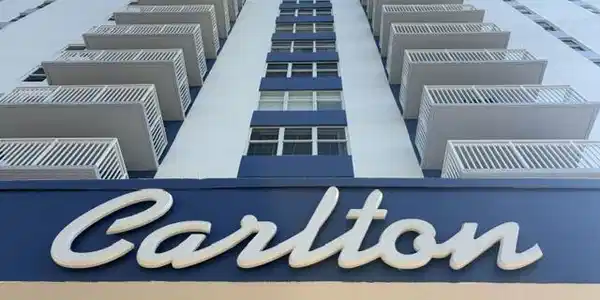 Image 2: Building exterior featuring multiple balconies wit
