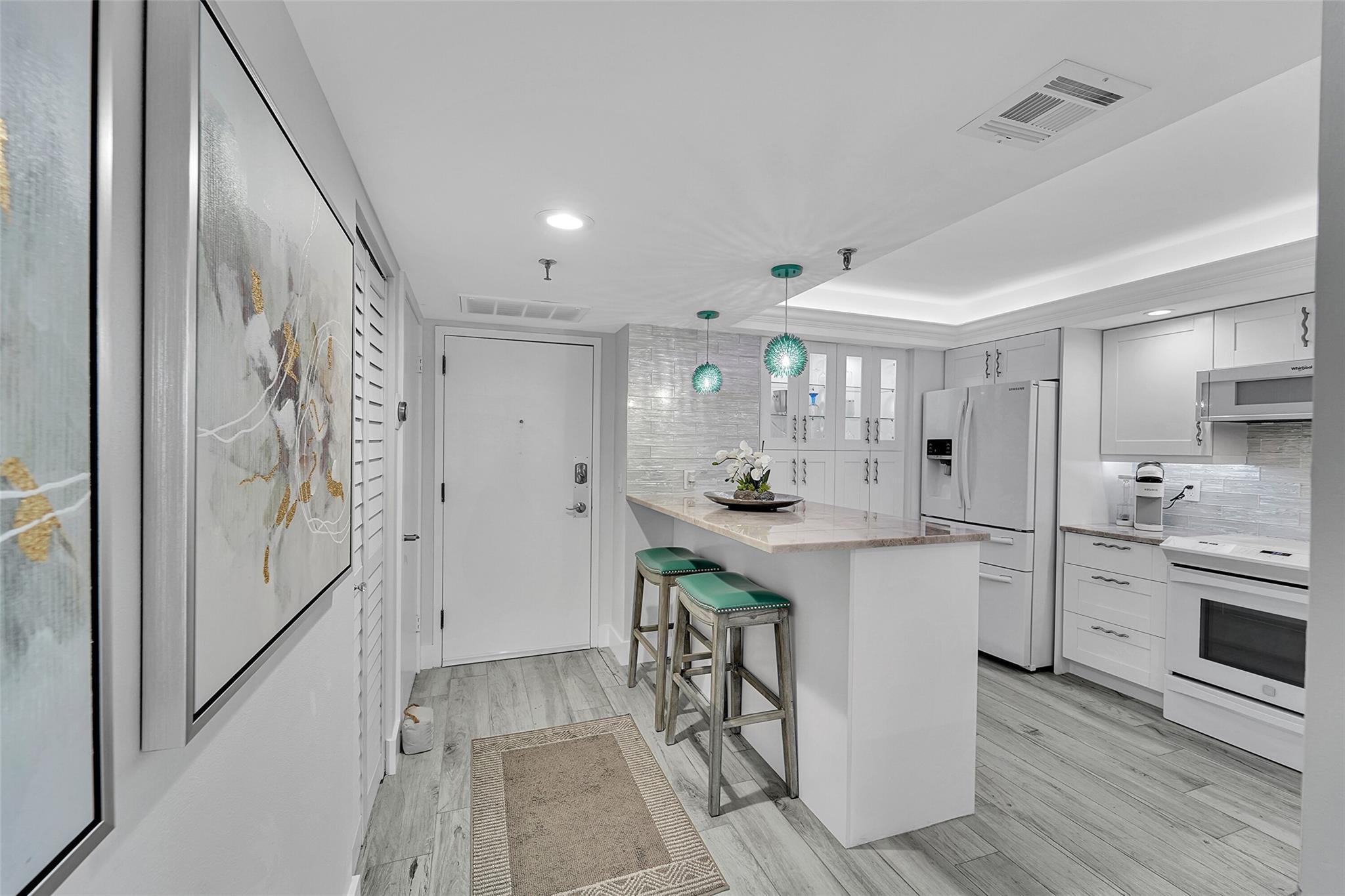Image 1: Open kitchen and renovated to detail. You will not