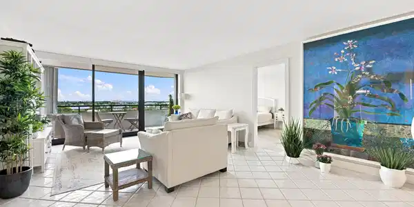 Image 4: Expansive living area featuring light-toned tile f