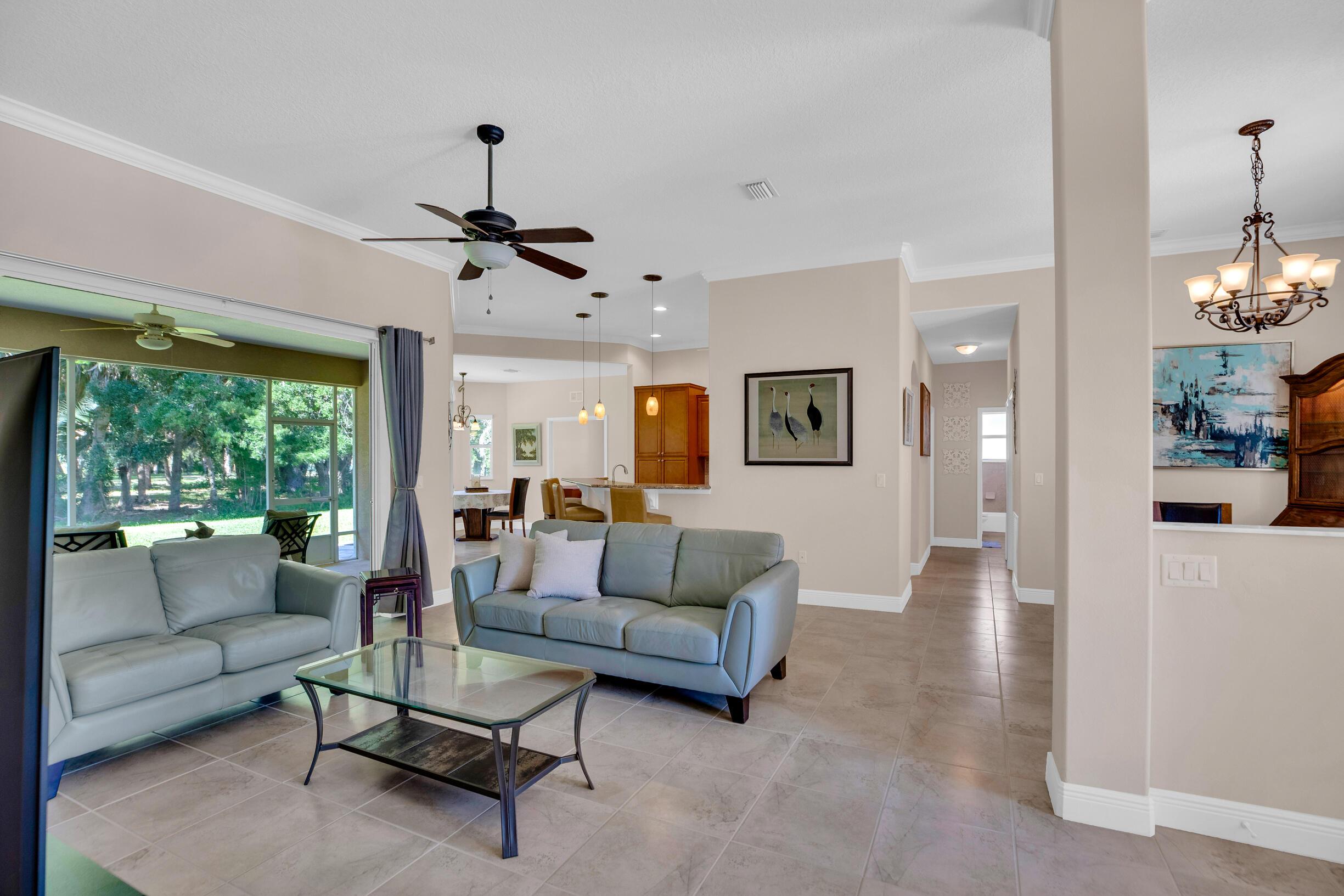 Image 3: Living room with sliders that pocket all the way b