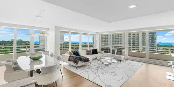 Image 3: THE LIVING ROOM & DINING ROOM ARE SURROUNED BY FLO