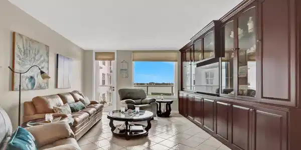 Image 3: Spacious Living Room with Water Views