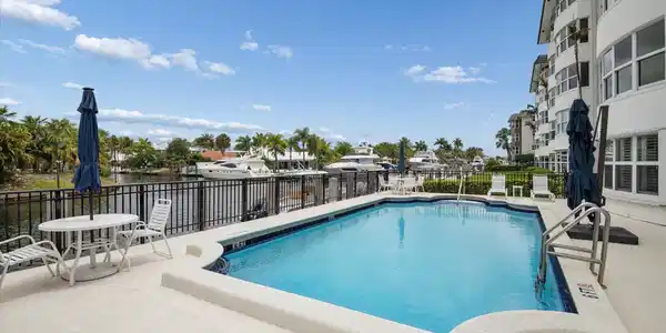 Image 3: Waterfront pool area overlooking the canal&mdash;perfect
